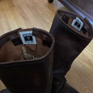 Gently used Frye brown leather riding boots. Ladies size 6. Decorate buckle.